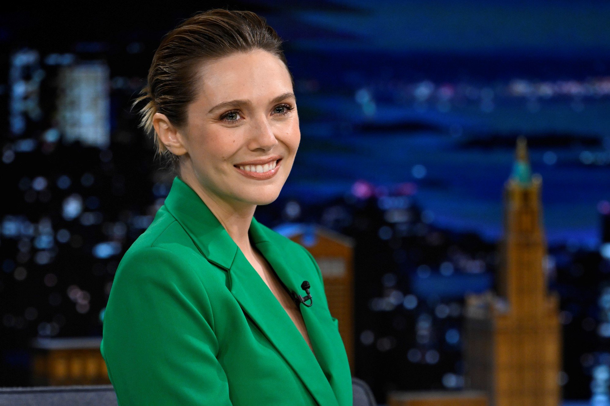 Elizabeth Olsen, who plays Wanda in 'Doctor Strange 2,' wears a green suit jacket.