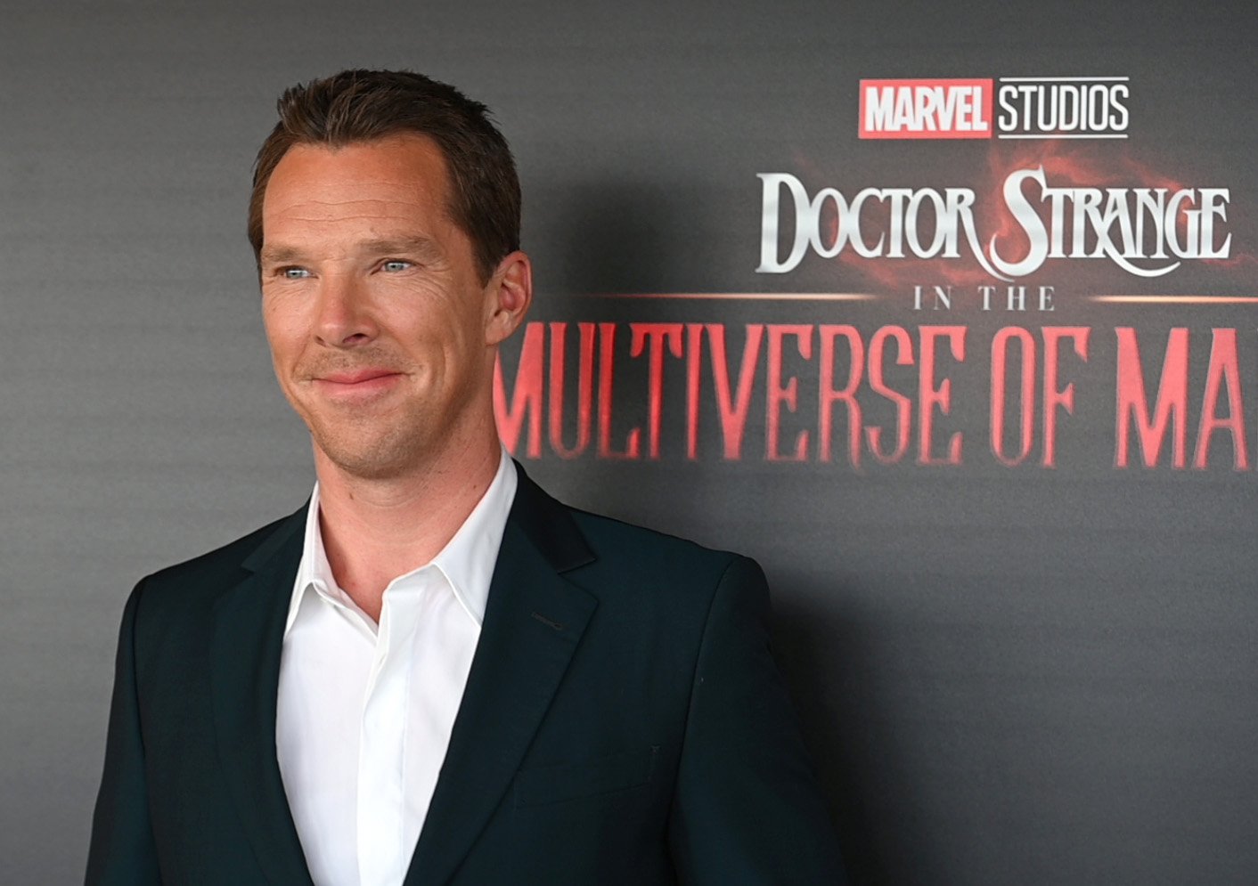 Benedict Cumberbatch, who stars in 'Doctor Strange in the Multiverse of Madness,' wears a black suit over a white button-up shirt.