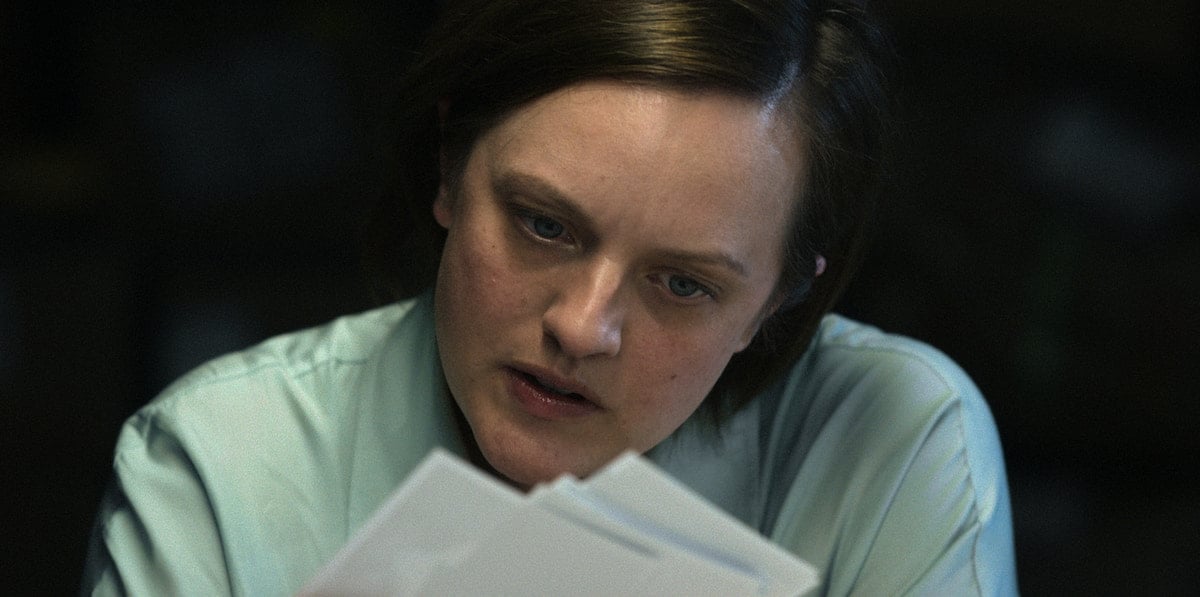 Elisabeth Moss looks at documents in 'Shining Girls' Season 1 Episode 3: 'Overnight'