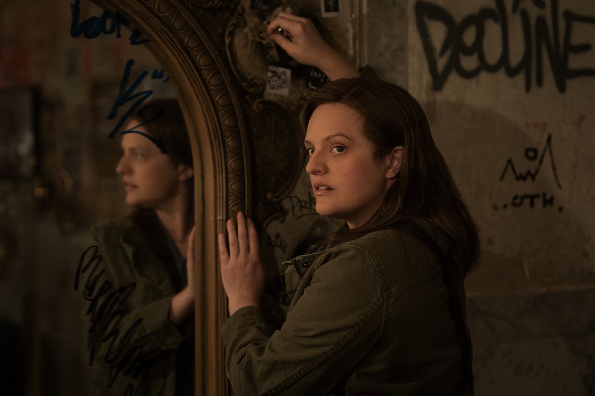 Elisabeth Moss looks on as Kirby in 'Shining Girls' Season 1 Episode 4: 'Attribution'