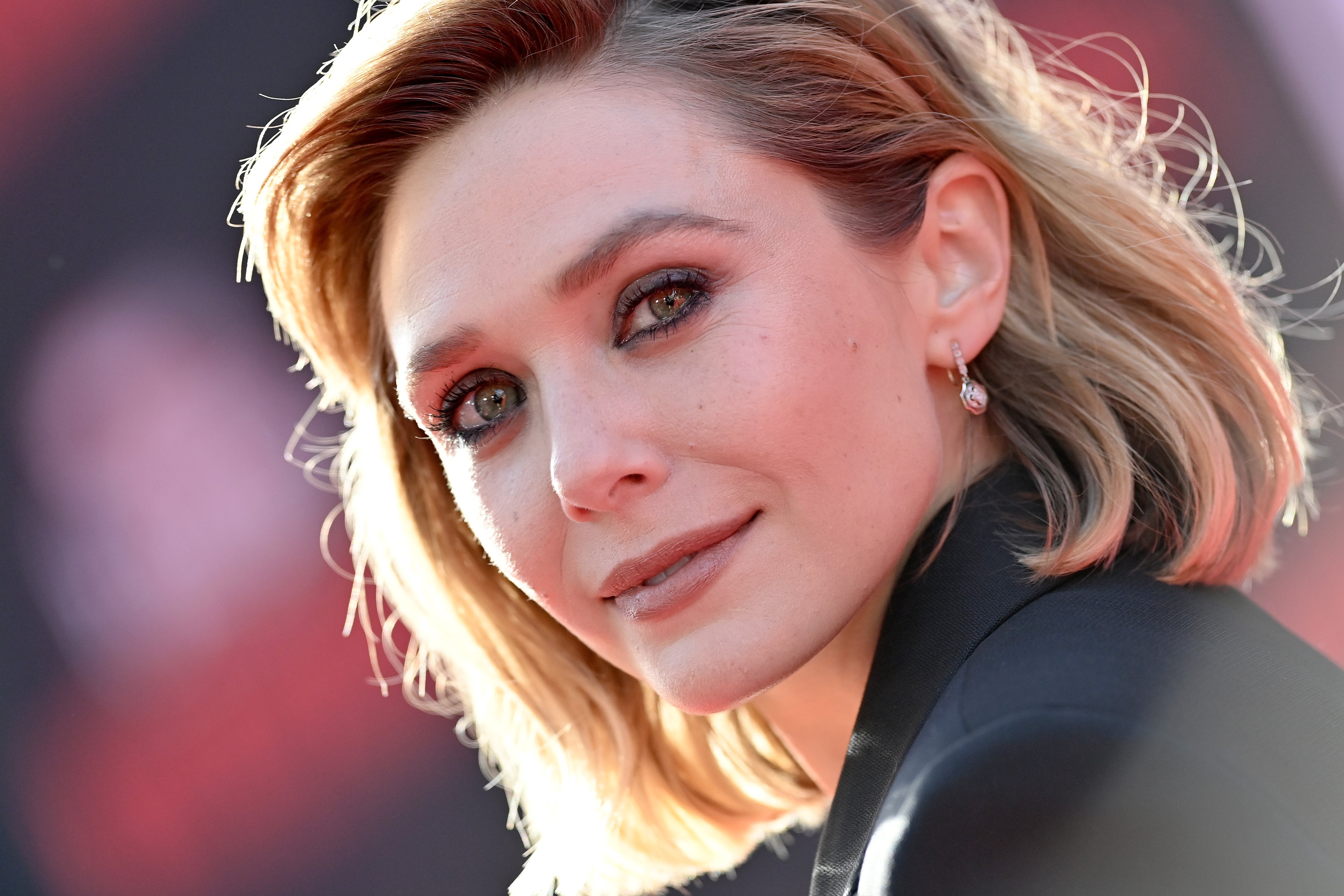 Elizabeth Olsen, who stars as the Scarlet Witch in the Marvel Cinematic Universe, wears a black suit jacket.