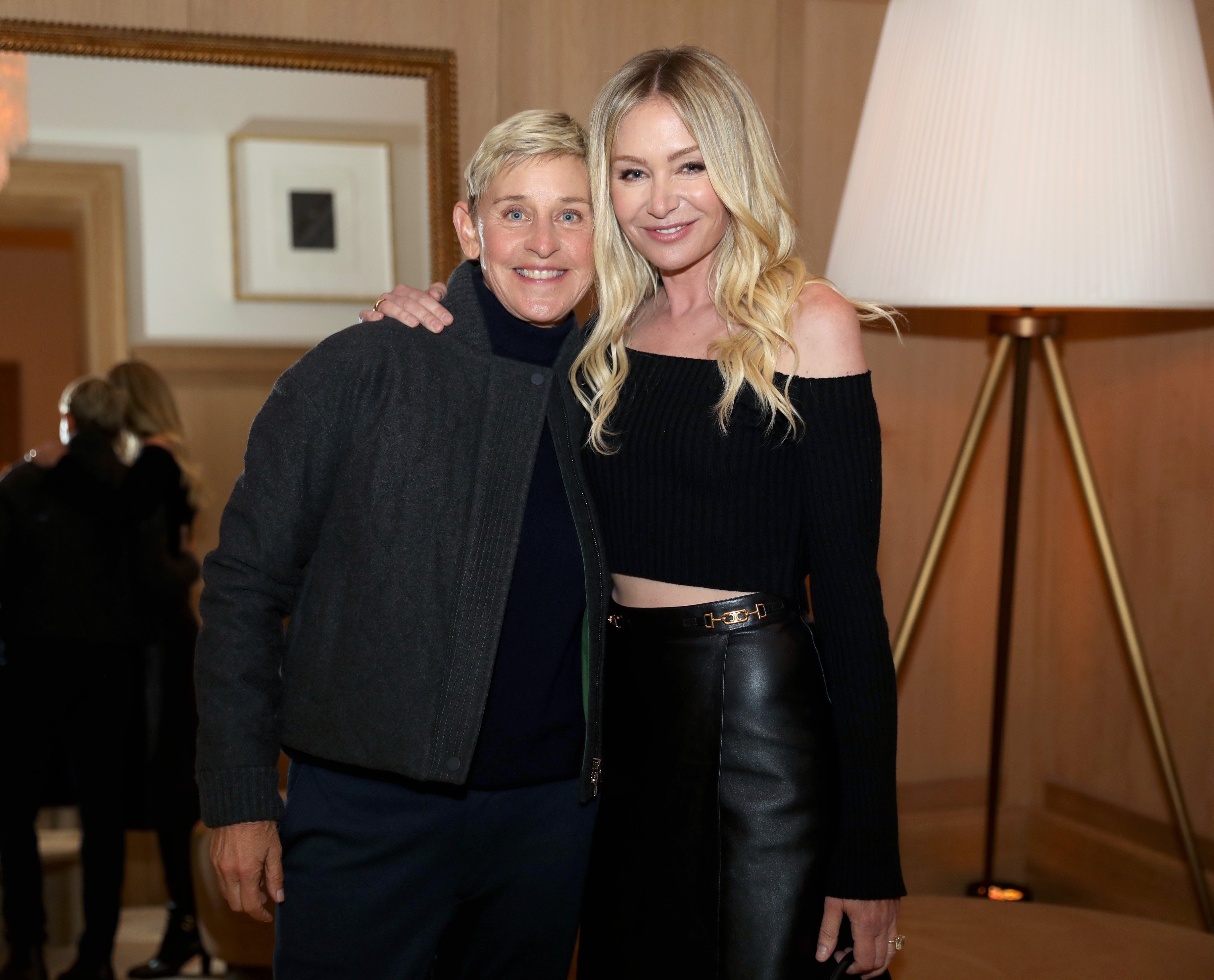 Ellen DeGeneres, who owns a few mansions with Portia de Rossi, pose for a photo together at an event in San Francisco