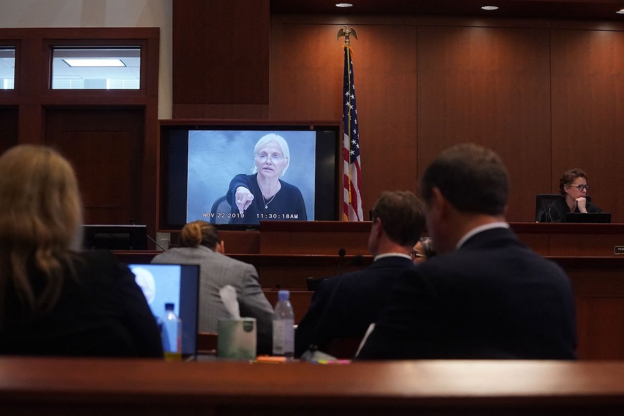 The deposition of Ellen Barkin plays as Johnny Depp sits in court