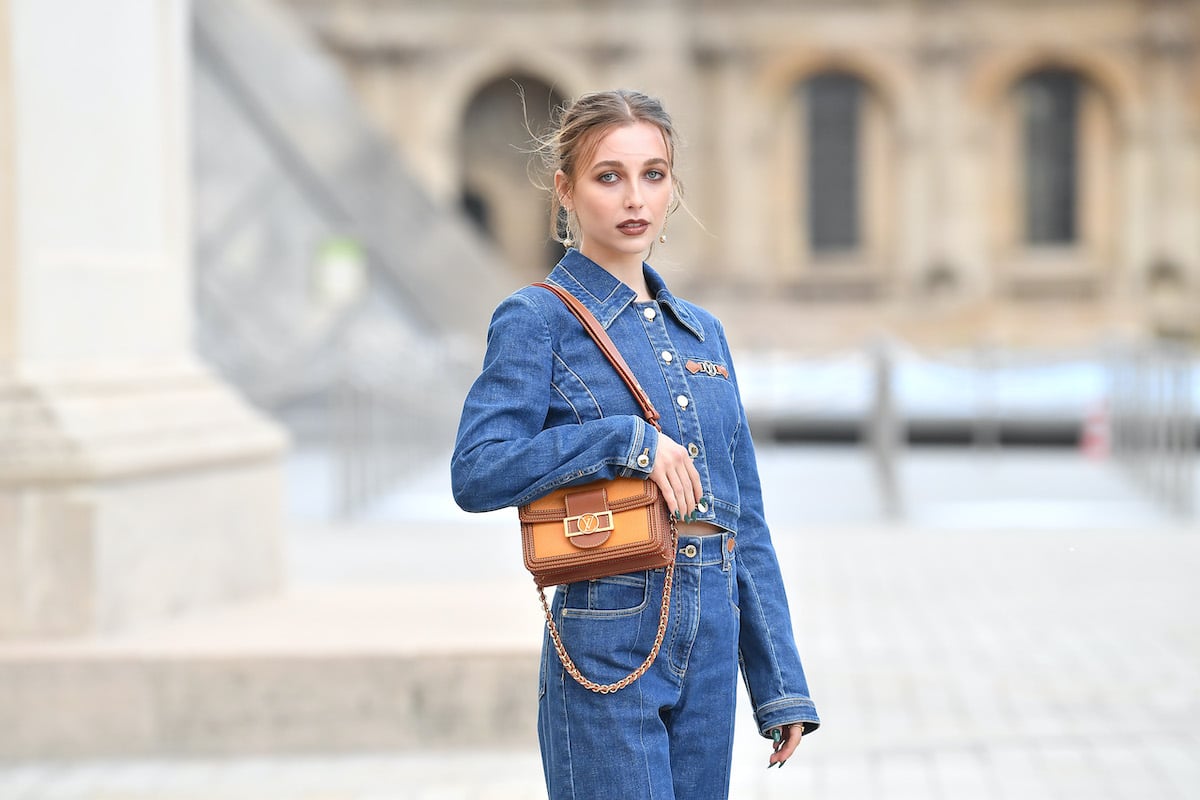 Emma Chamberlain in front of a blurred background