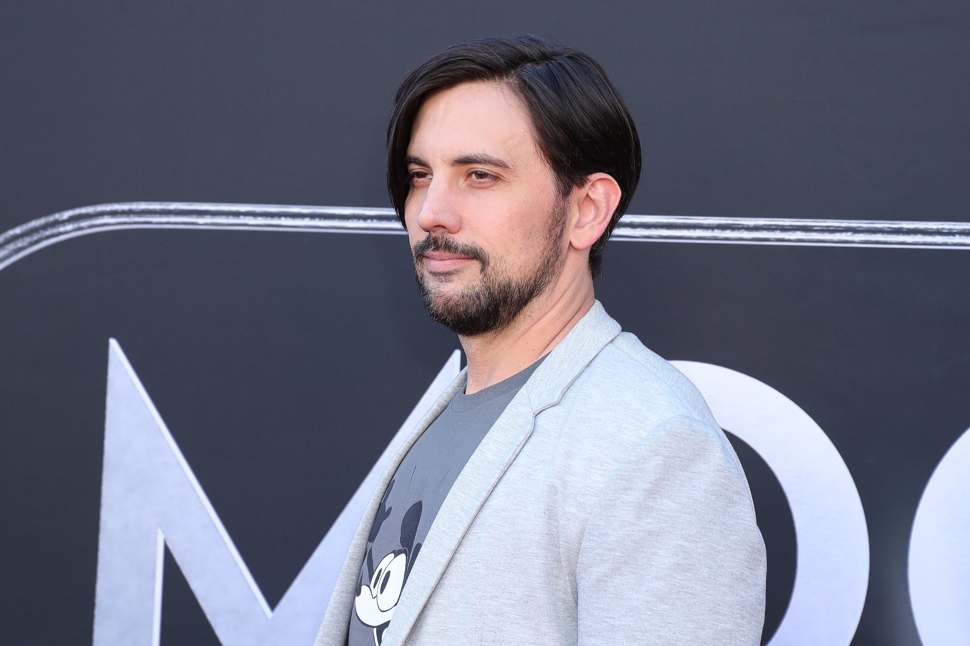 'Fantastic Four' writer Jeremy Slater, who introduced a different villain in the first script draft. Slater is wearing a grey jacket in front of a 'Moon Knight' logo.