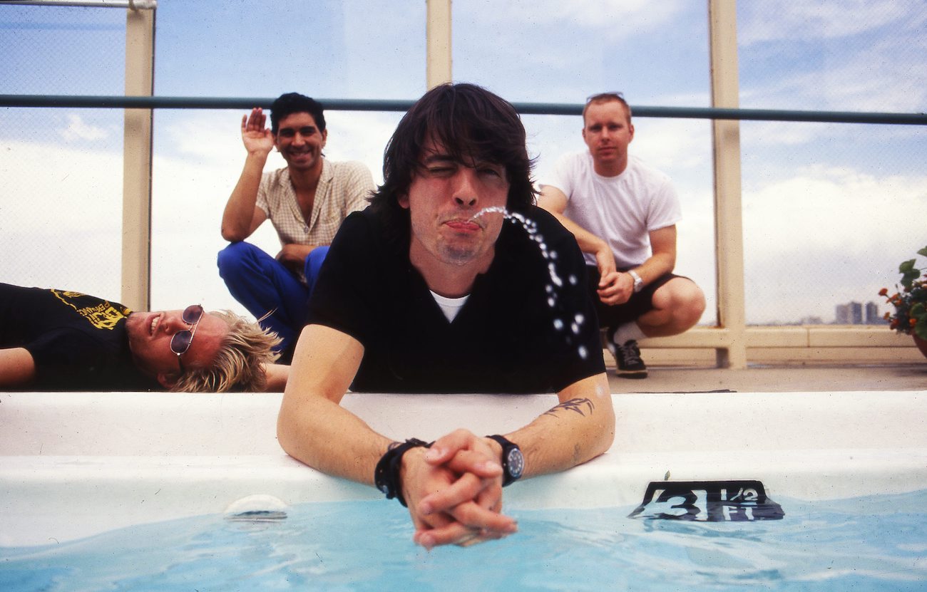 Foo Fighters posing by a pool in Denver, 1998.