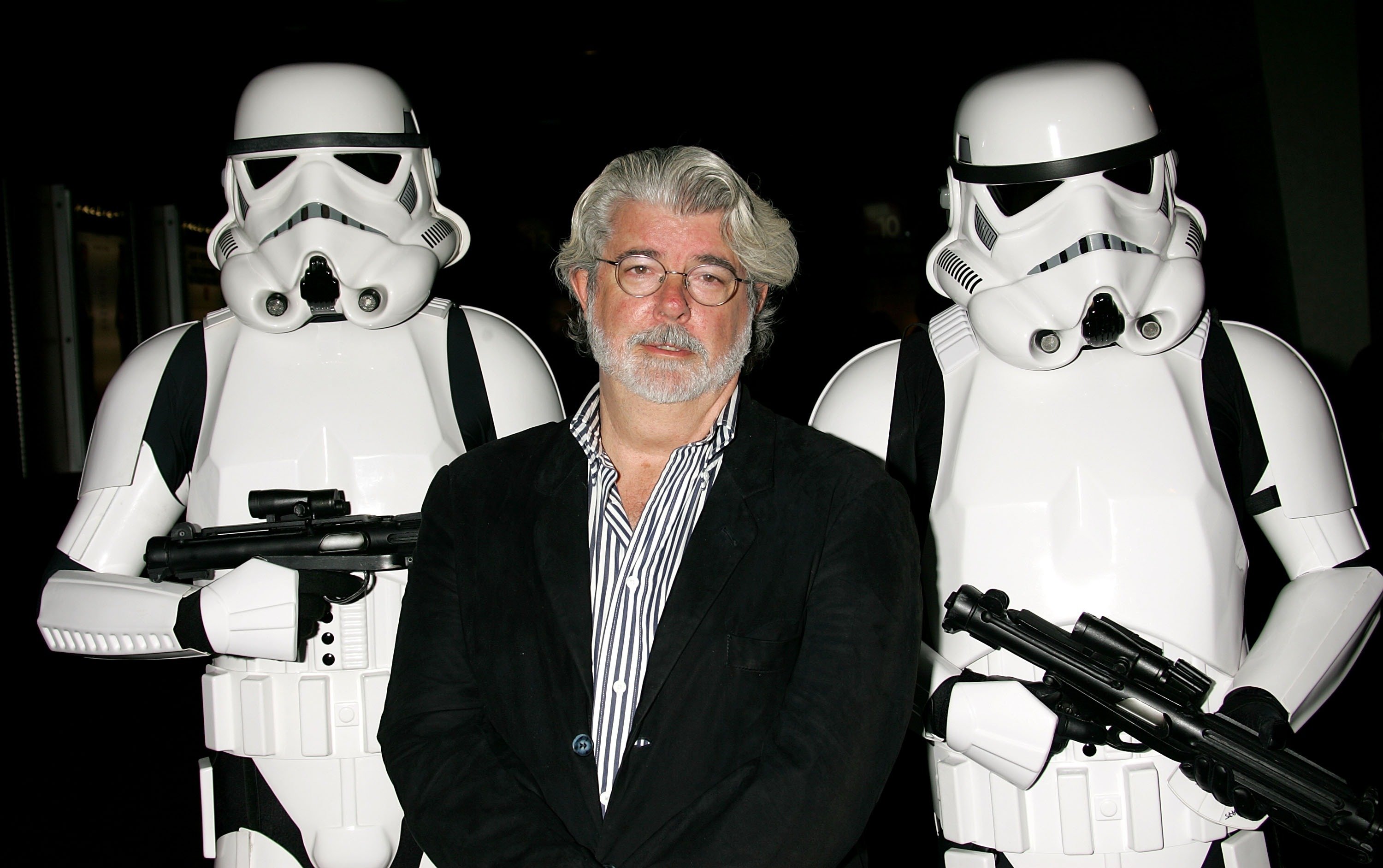 George Lucas appears with stormtrooper characters at AFI's 40th anniversary celebration of Star Wars Episode IV: A New Hope