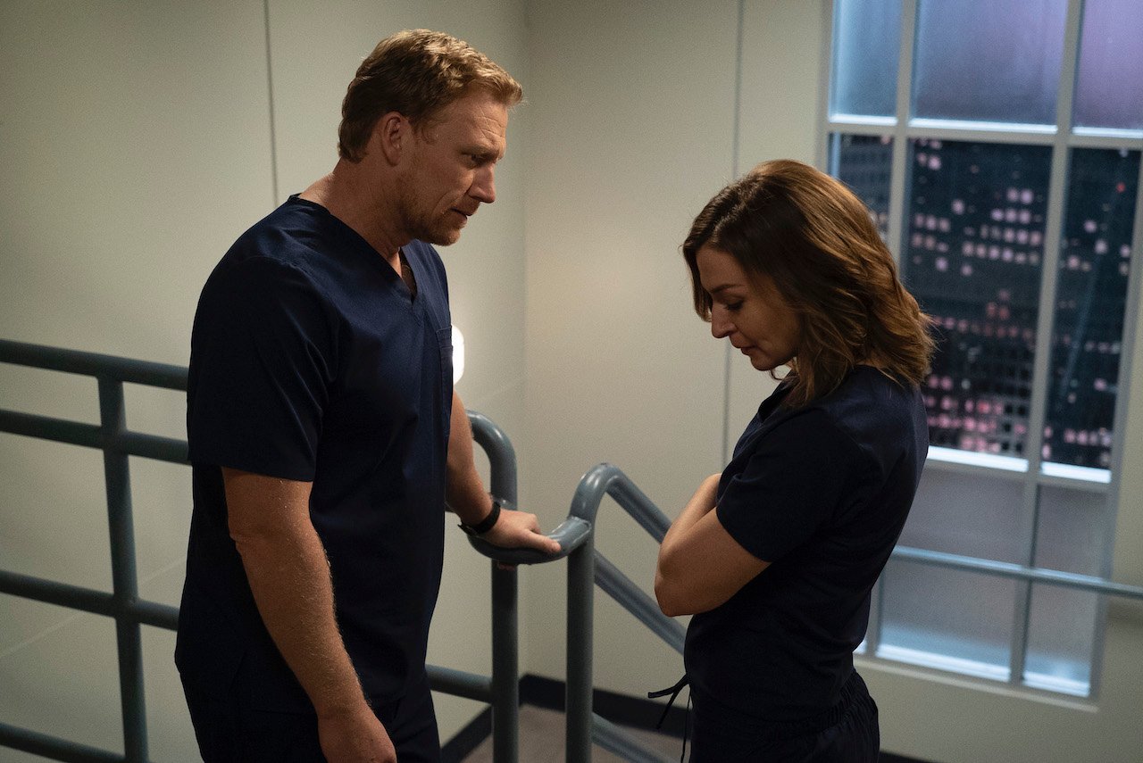 Kevin McKidd as Owen Hunt and Caterina Scorsone as Amelia Shepherd on 'Grey's Anatomy' talk in the stairwell.