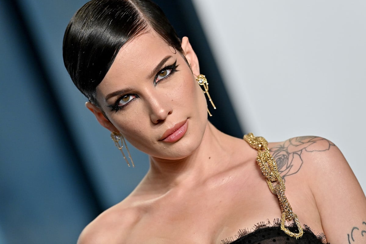 Halsey stares into the camera at an event.