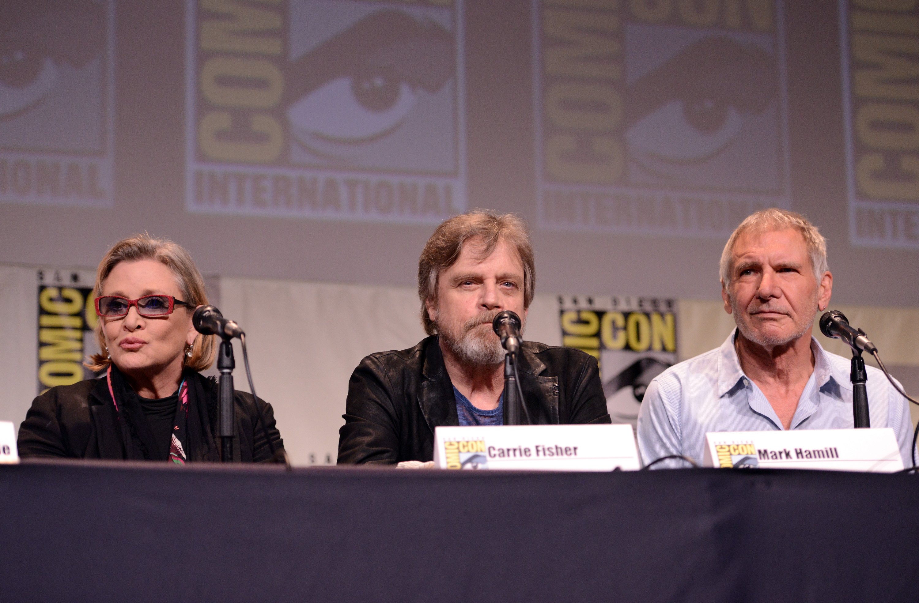 Harrison Ford, who has a net worth of $300 million, Carrie Fisher, and Mark Hamill speak at a Lucasfilm panel during Comic Con 2015