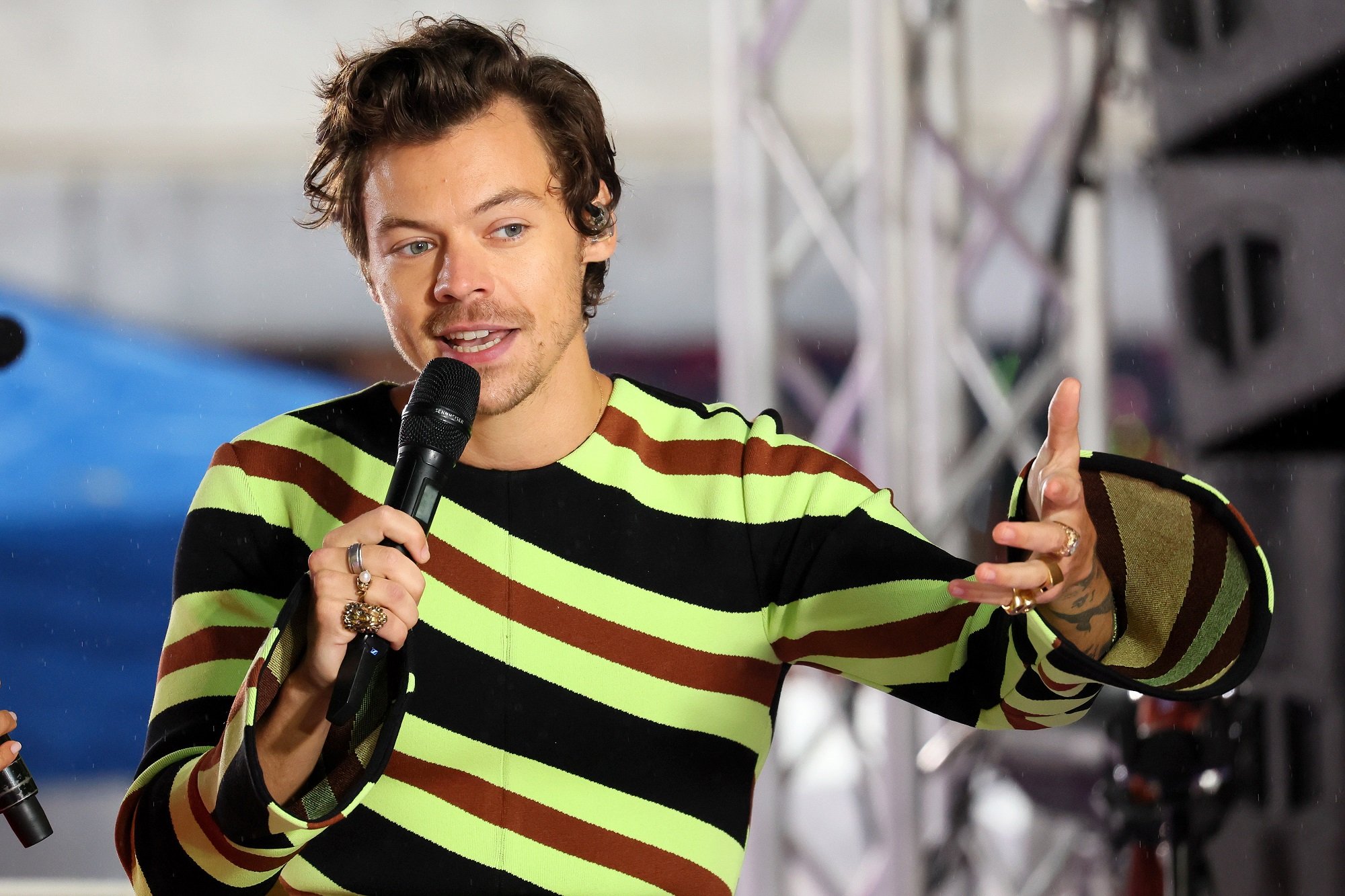 Harry Styles wearing a striped shirt onstage at NBC's 'Today'