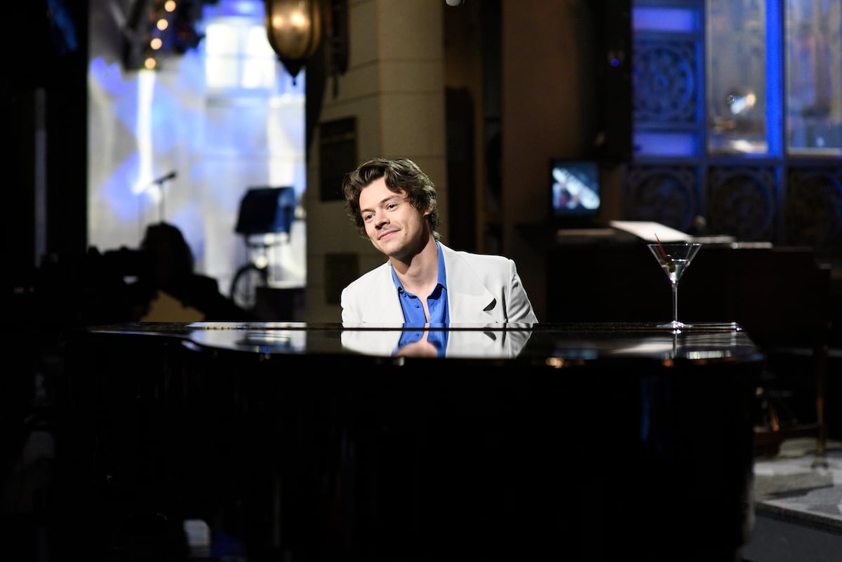 Host Harry Styles plays the piano during Saturday Night Live