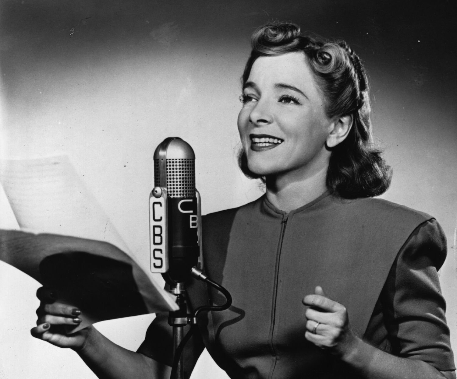 American stage actress Helen Hayes reads for a CBS broadcast.