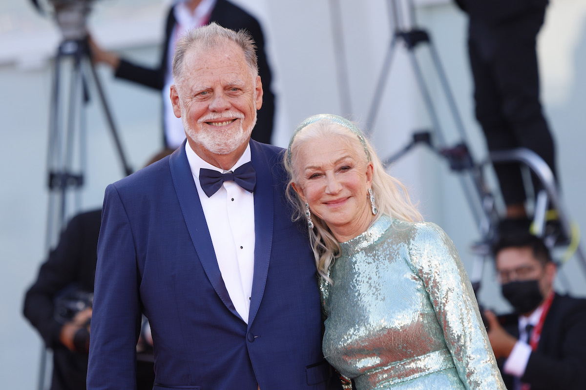 Actor Helen Mirren and her husband Taylor Hackford smile for cameras in 2021