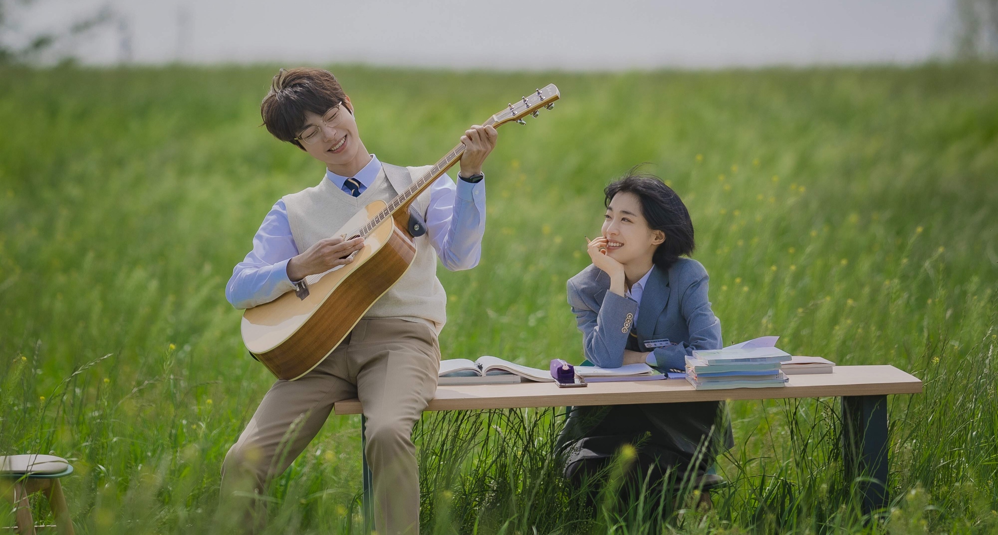 Hwang In-yeop and Choi Sung-run in 'The Sound of Magic' in a meadow field.