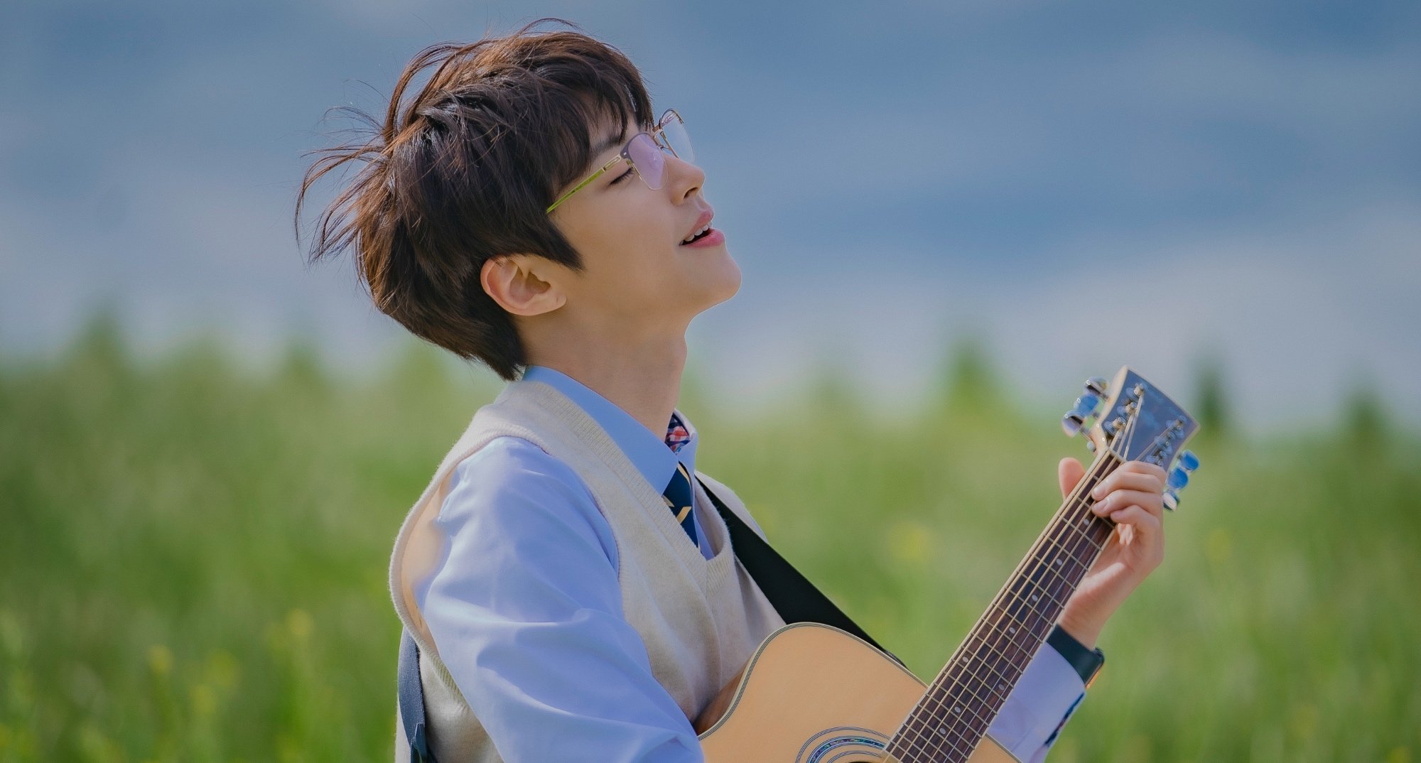 Hwang In-youp in the musical K-drama 'The Sound of Magic' holding a guitar.