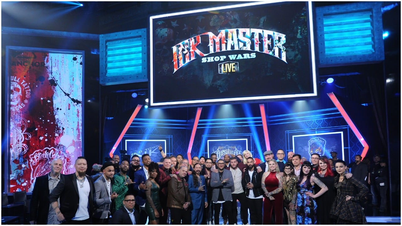 Cast poses for a photo together during the "Ink Master" Season 9 Live Finale