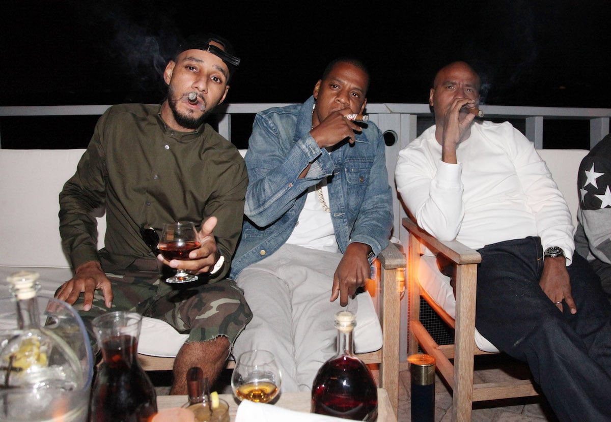 Swizz Beatz, Jay Z, and 'OG' Juan Perez pose for photos at a D'USSE Cognac event in 2012