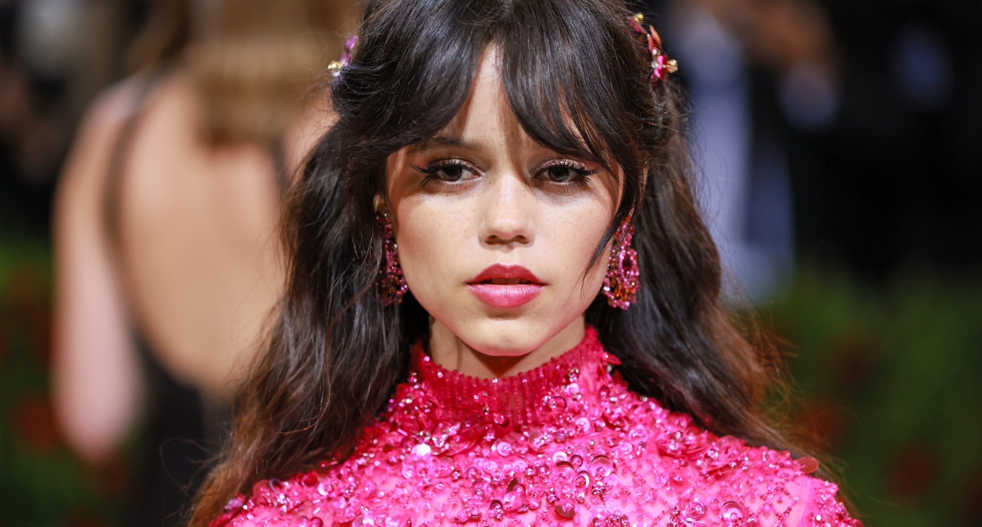 Jenna Ortega stars in Tim Burton's Netflix series 'Wednesday' wearing a pink ensemble.