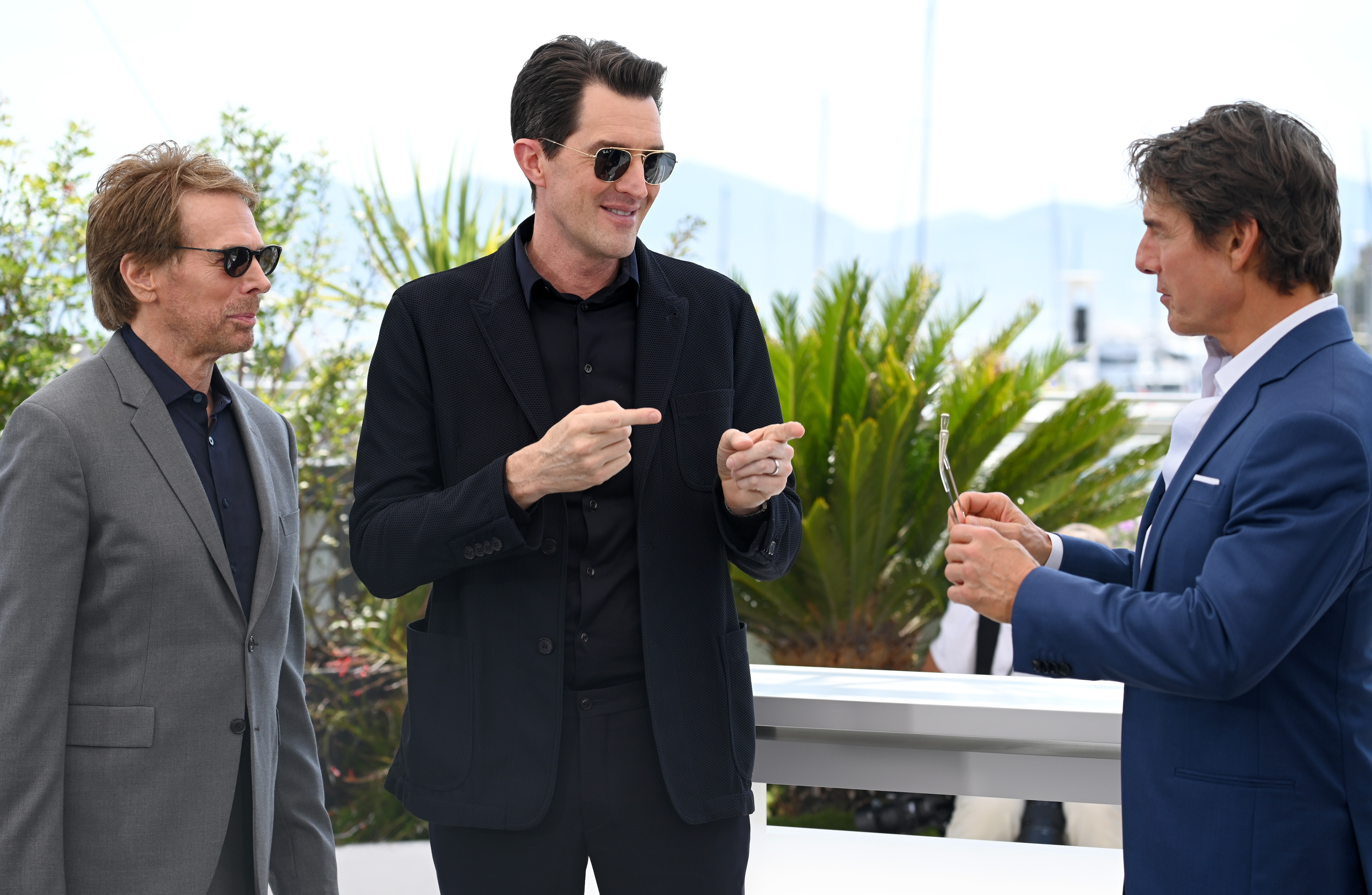 Jerry Bruckheimer, director Joseph Kosinski, and Tom Cruise attend a photocall for the sequel Top Gun: Maverick at the Cannes film festival