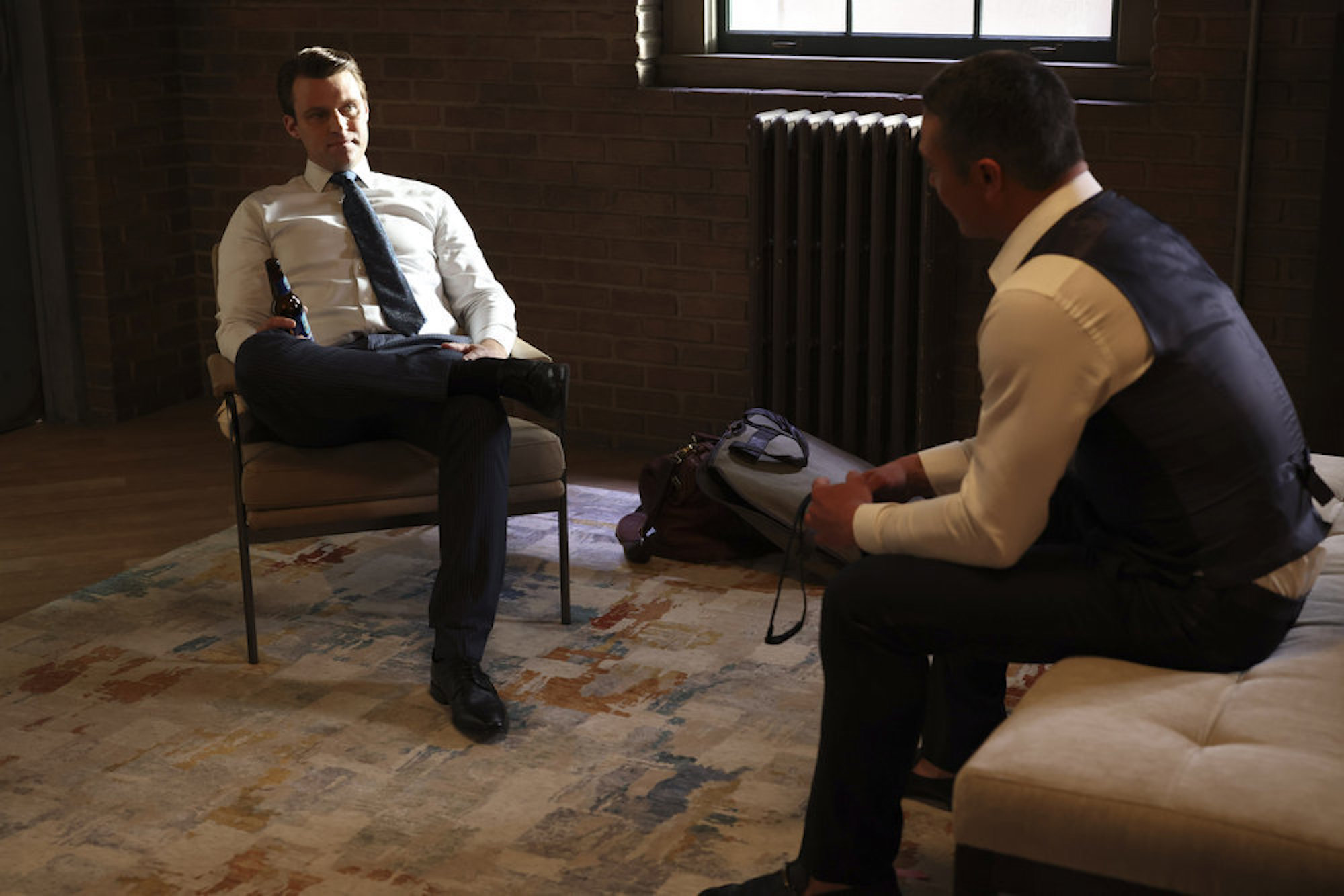 Jesse Spencer as Matt Casey and Taylor Kinney as Kelly Severide in wedding attire talking in the 'Chicago Fire' Season 10 finale