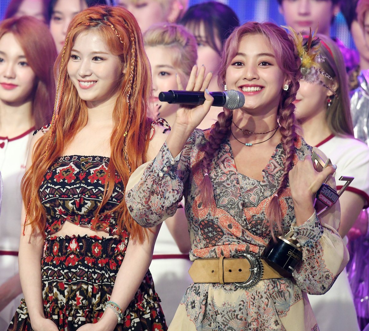 The members of Stray Kids hold up peace signs at the Asia Artist Awards 2021