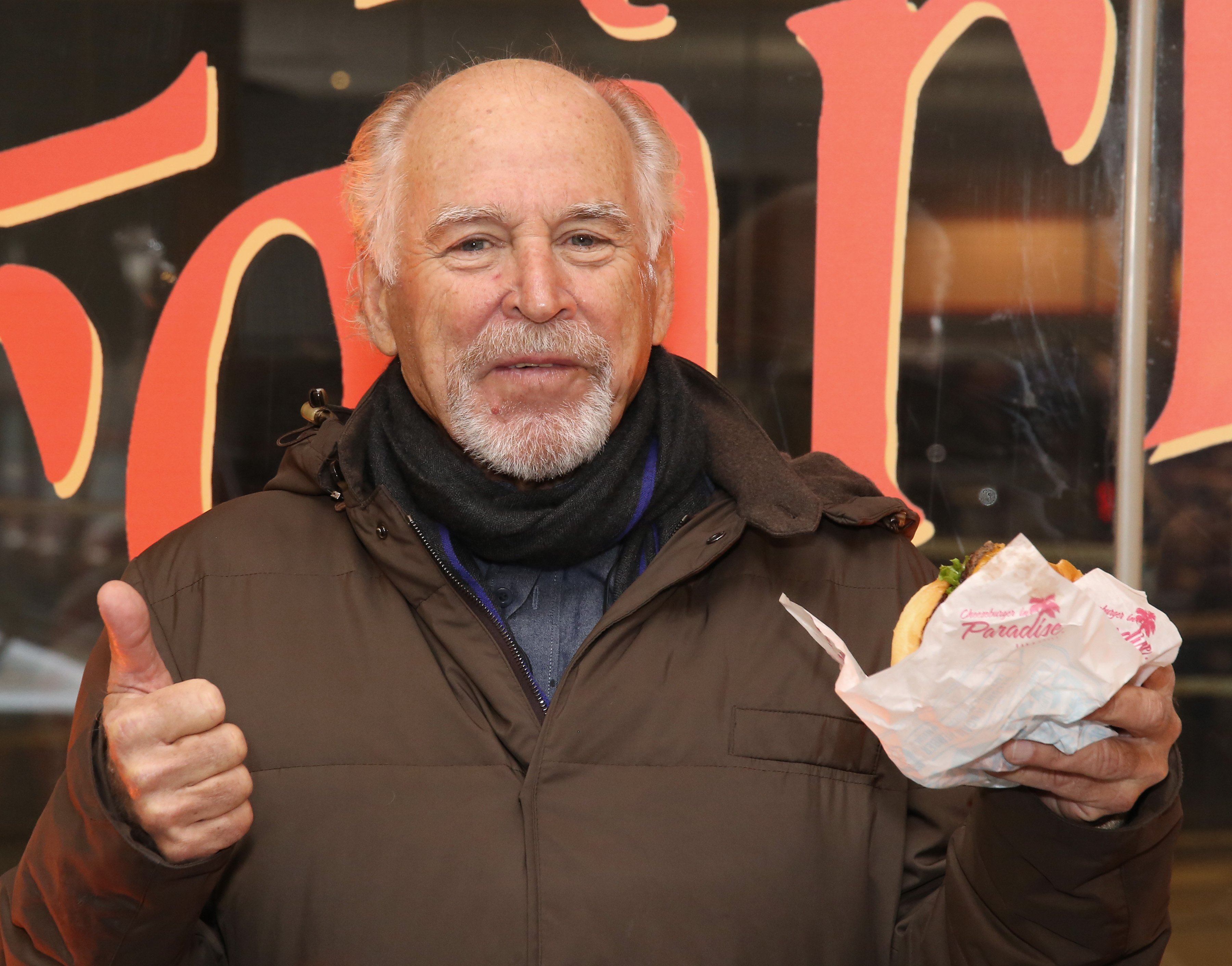 Jimmy Buffett with a "Cheeseburger in Paradise."