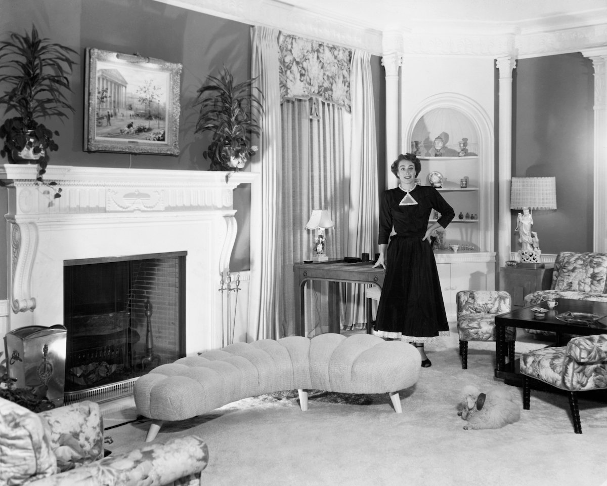 Glamorous Joan Crawford is shown in the sitting room of her spacious Brentwood, California, home