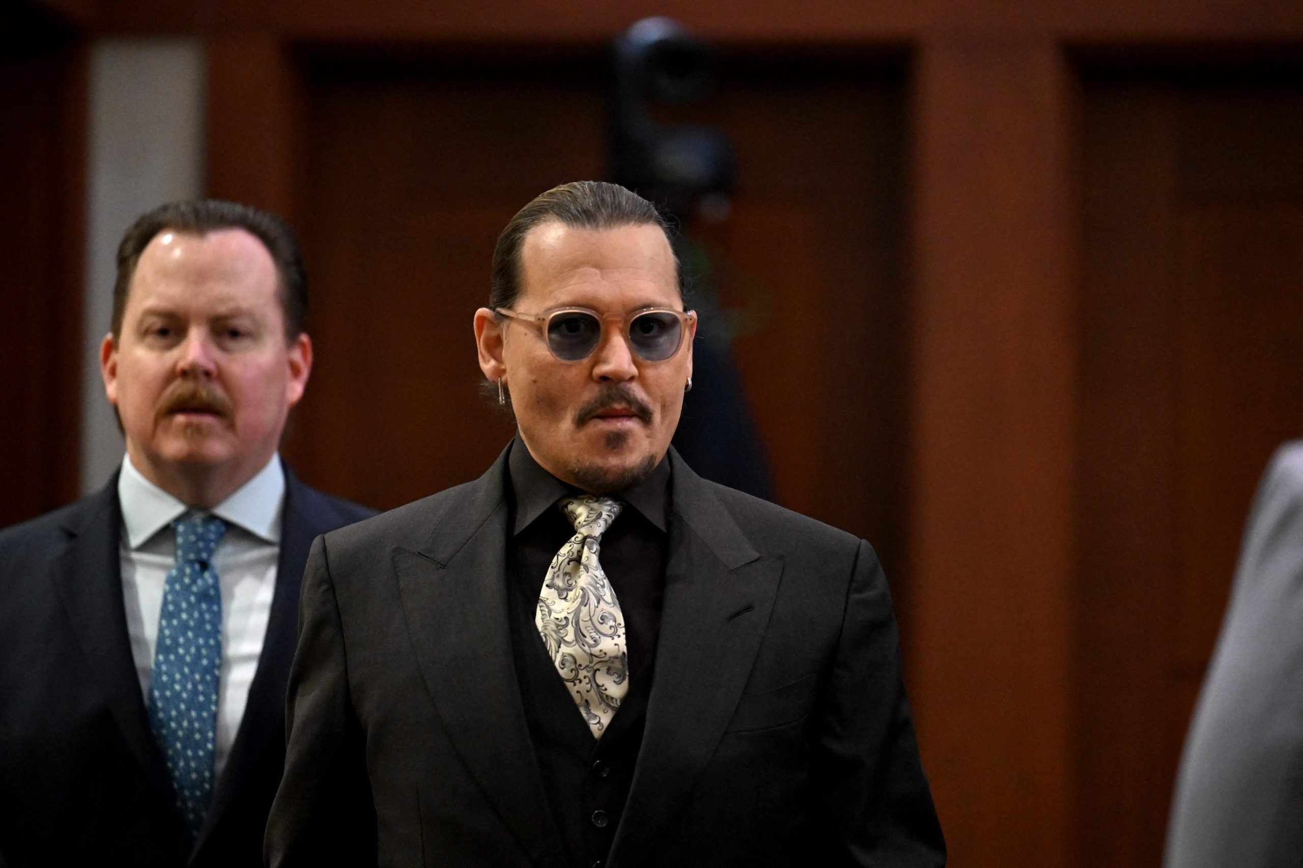 US actor Johnny Depp arrives at the Fairfax County Circuit Courthouse in Fairfax, Virginia, on April 19, 2022. - Depp is suing ex-wife Amber Heard for libel after she wrote an op-ed piece in The Washington Post in 2018 referring to herself as a public figure representing domestic abuse.