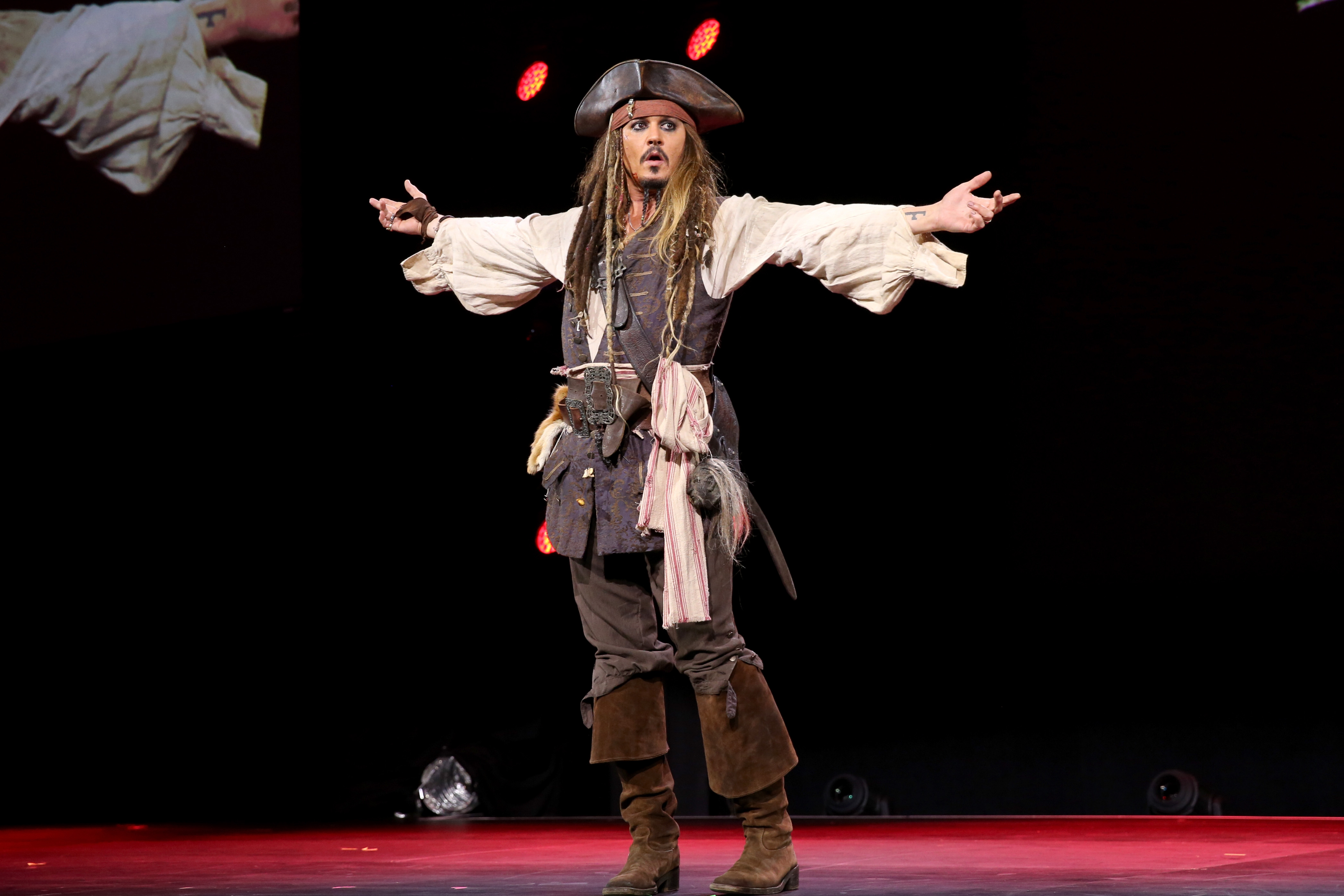 Johnny Depp is dressed as Jack Sparrow at a presentation for Pirates of the Caribbean: Dead Men Tell No Tales at D23 EXPO 2015