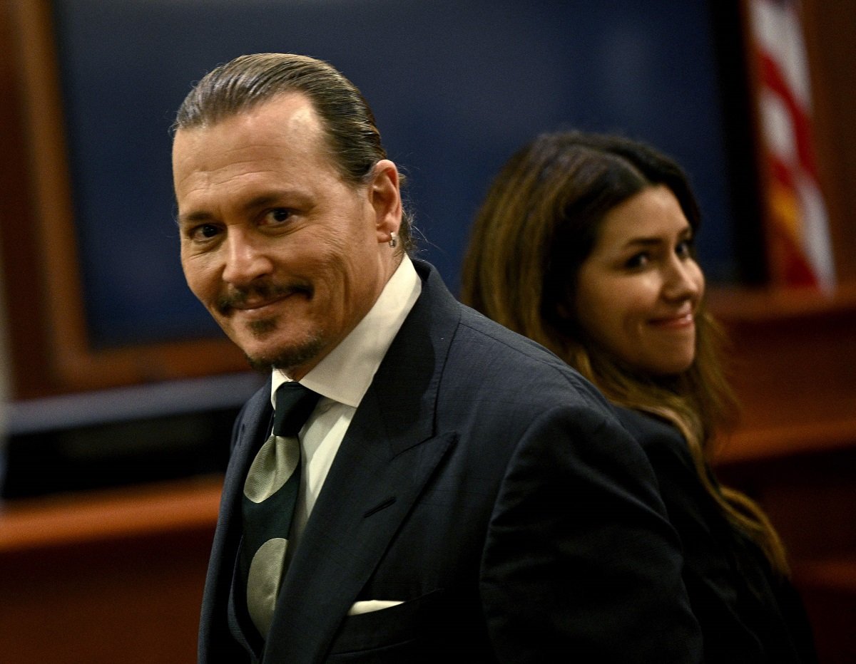 Johnny Depp and his attorney Camille Vasquez, who some fans think might be dating, standing inside courtroom at the Fairfax County Circuit Courthouse 