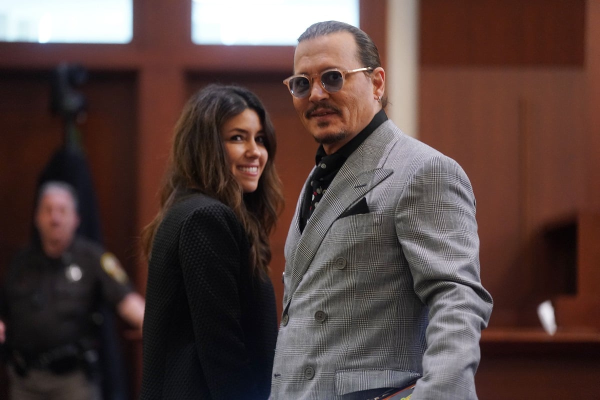 Johnny Depp and his lawyer Camille Vasquez smile during a courtroom break