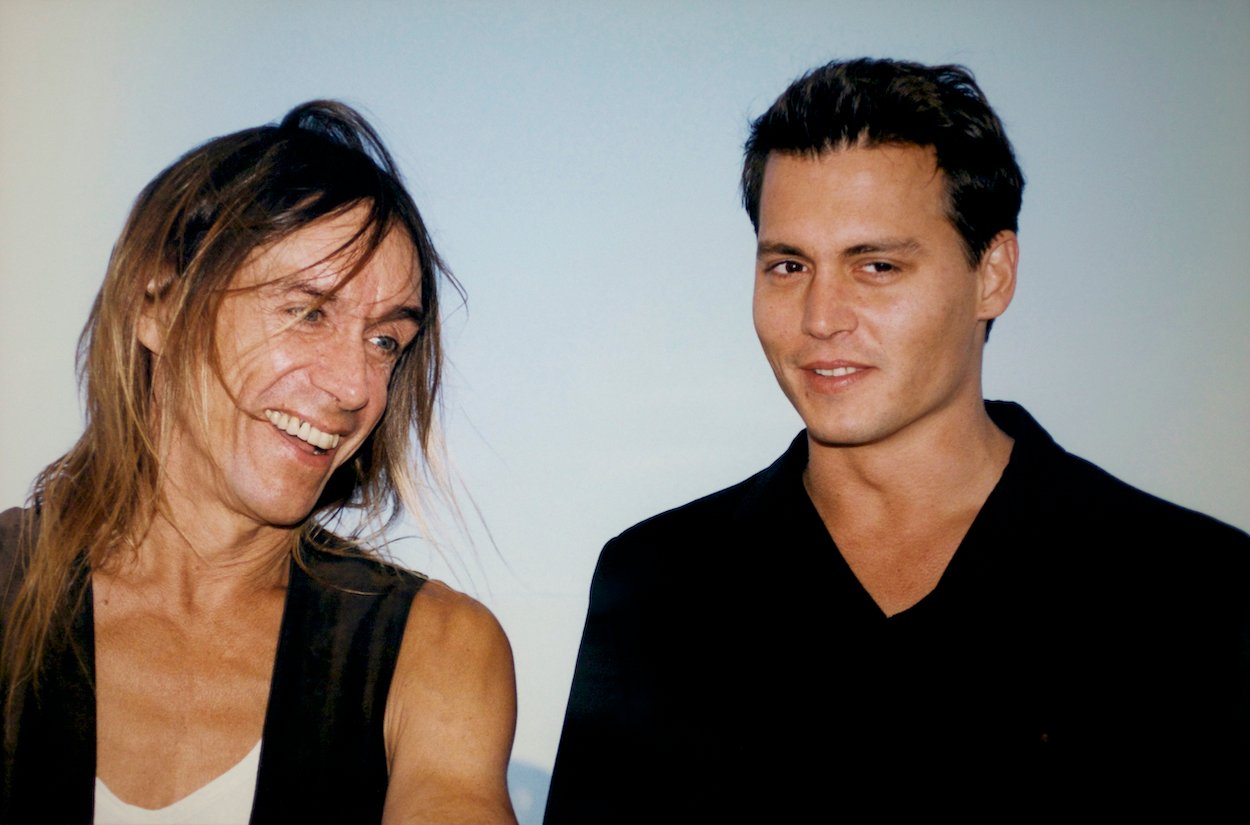 Iggy Pop (left) and Johnny Depp in Cannes, France, in 1997. A drunk Depp met Pop as a teenager; Pop called him a 'turd' and Depp called it 'one of the best moments' of his life.