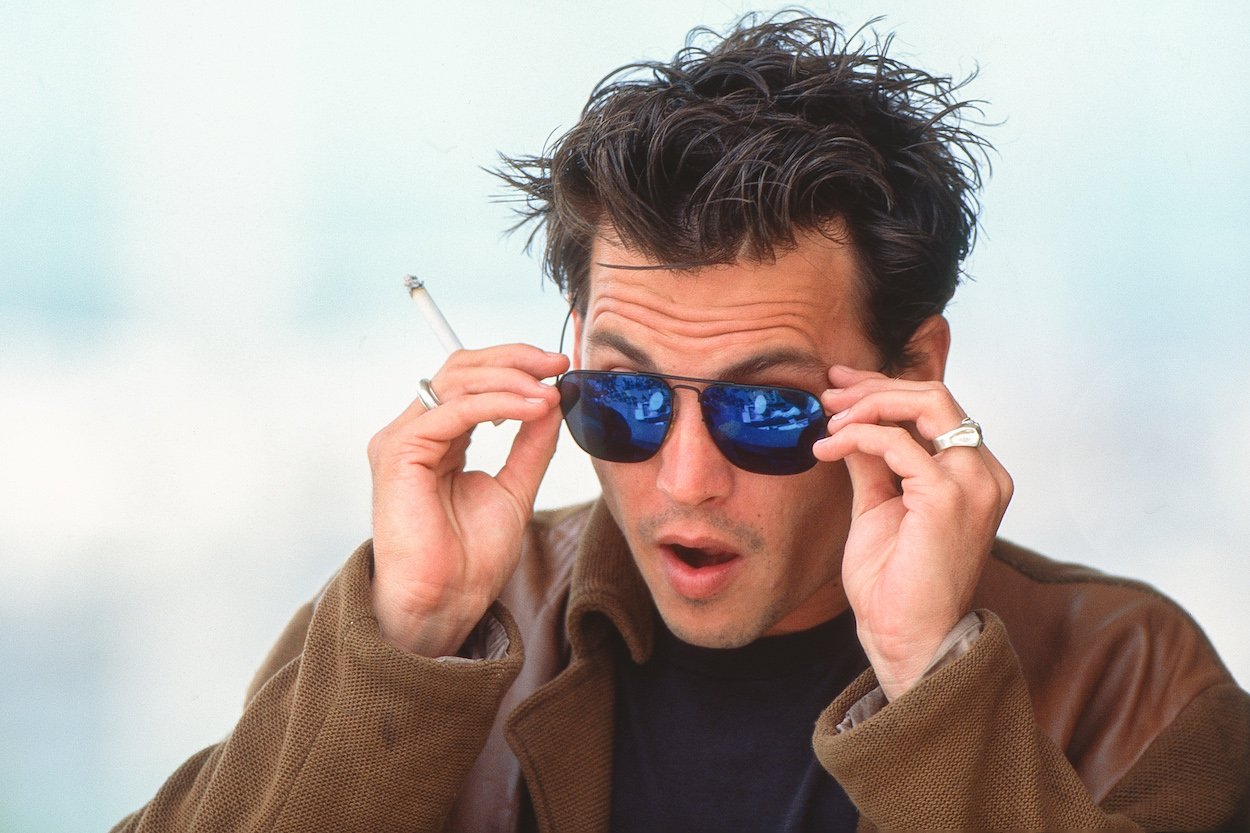 Johnny Depp attends the 1995 Cannes Film Festival. Depp once stopped a mugger with his mere presence an then offered the would-be robber some life advice.