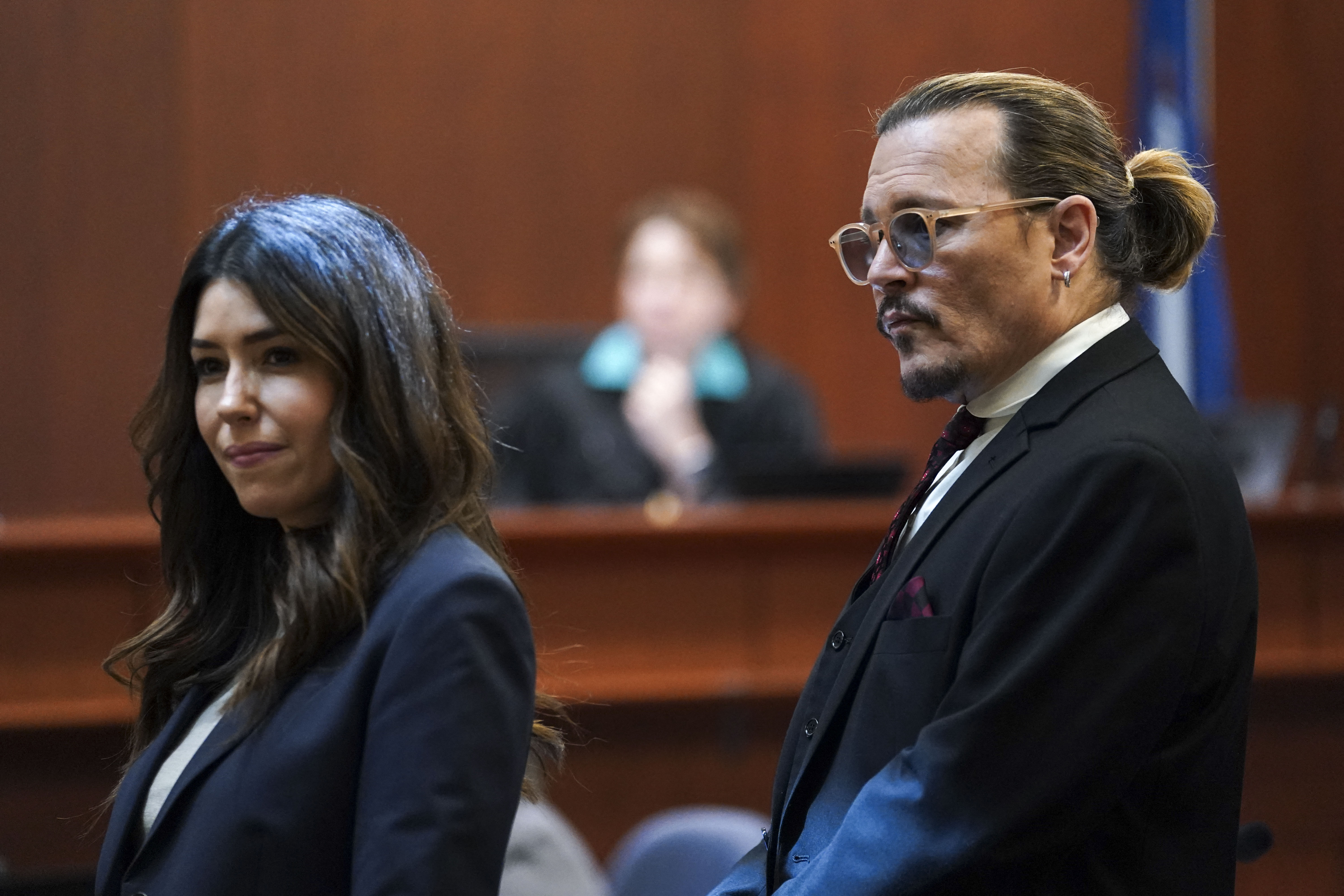 Johnny Depp standing next to his attorney Camille Vasquez during the defamation trial against ex-wife Amber Heard