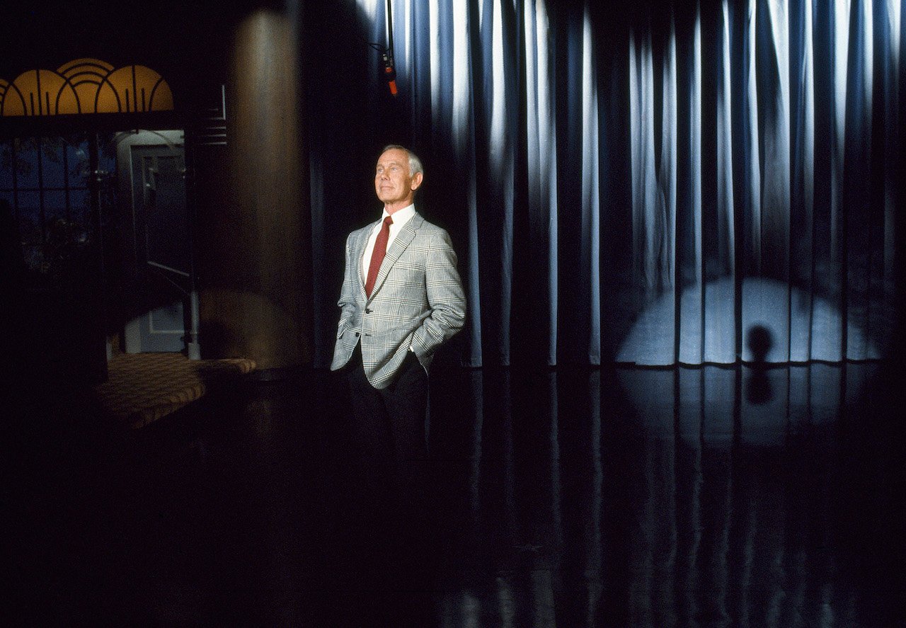 Johnny Carson stands in front of a 'Tonight Show' audience