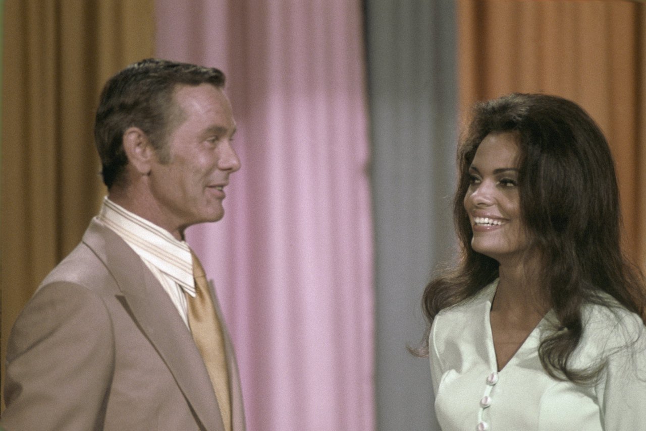 Johnny Carson and an unknown individual 