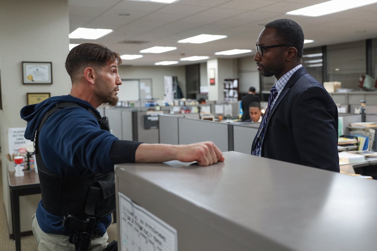 Jon Bernthal as Wayne Jenkins wearing plainclothes and Jamie Hector as Sean Suiter wearing a suit in 'We Own This City