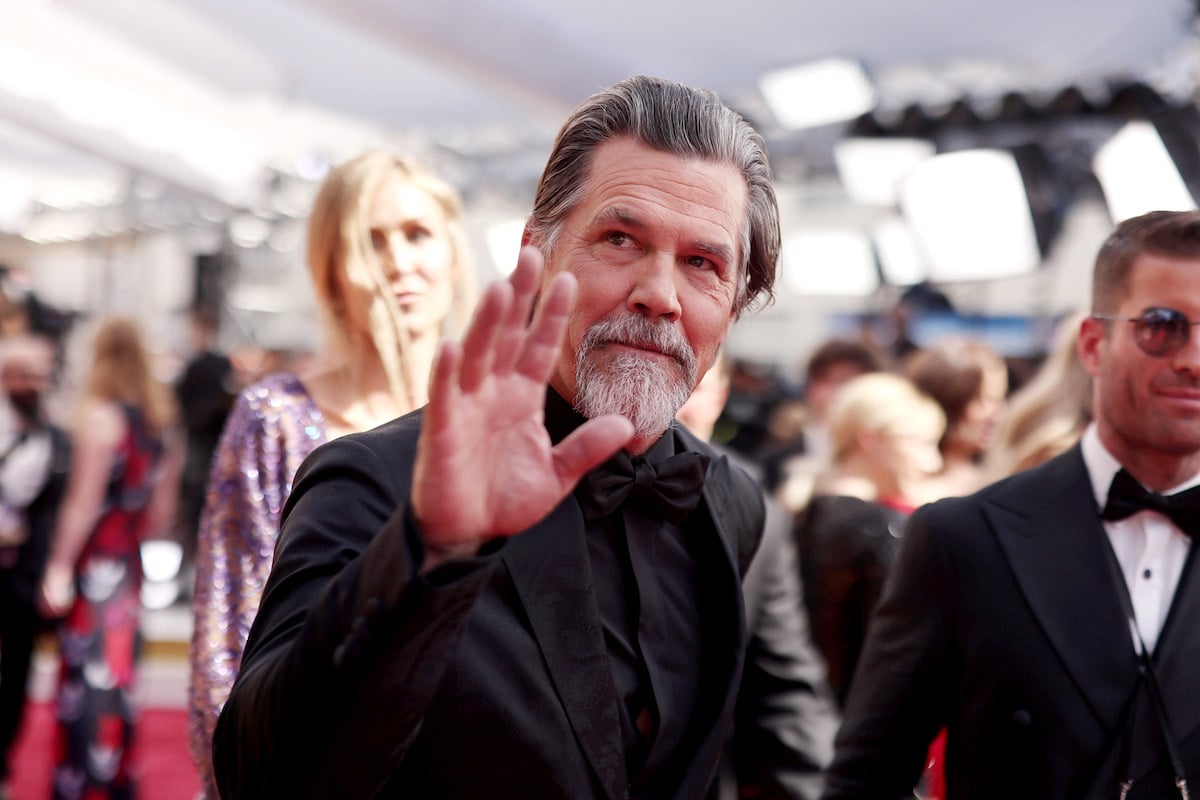 Actor Josh Brolin waves at photographers at the 2022 Oscars