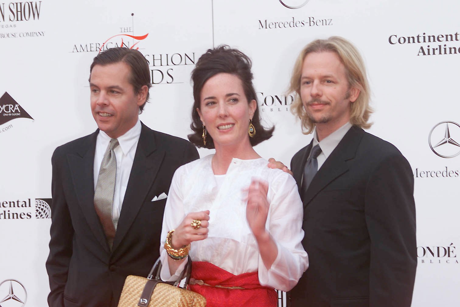 Kate Spade, Andy Spade, and David Spade smiling together at an event