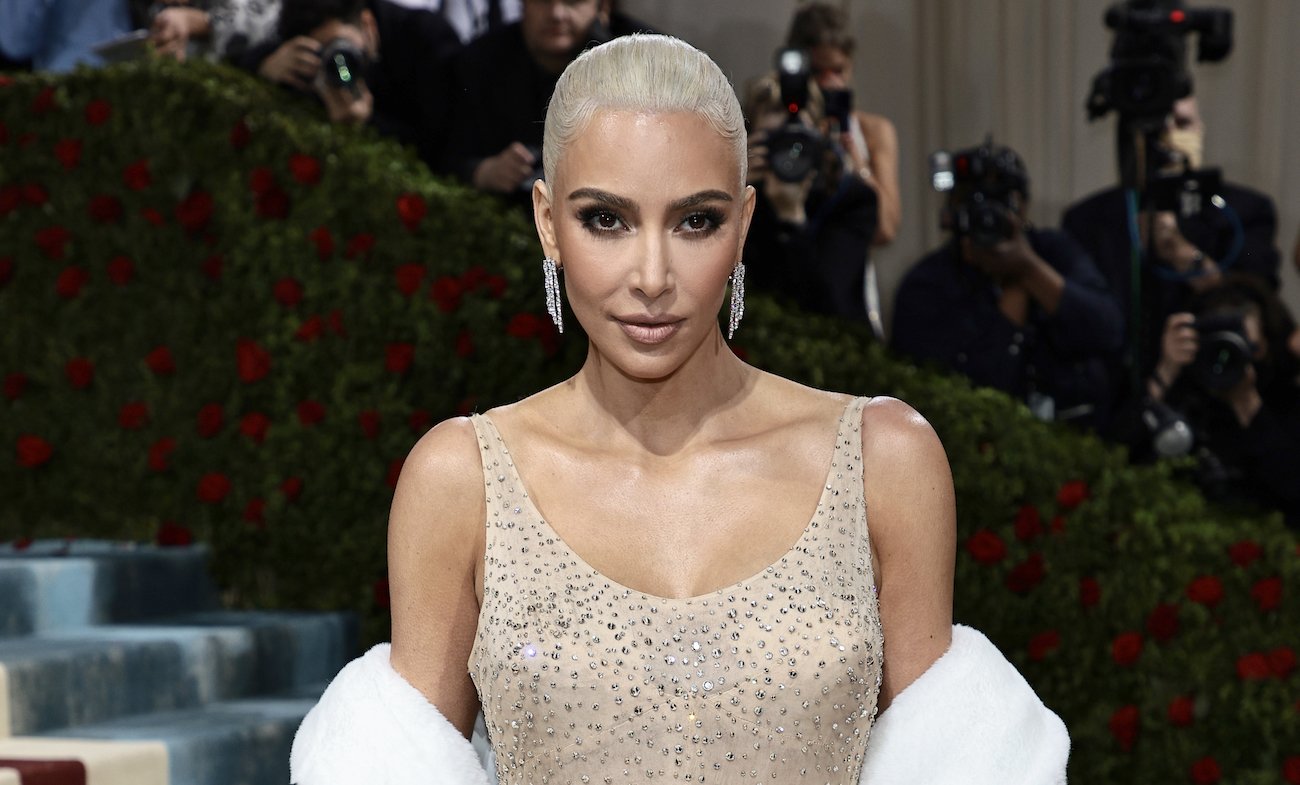 Kim Kardashian looking on while wearing Marilyn Monroe's dress at the Met Gala