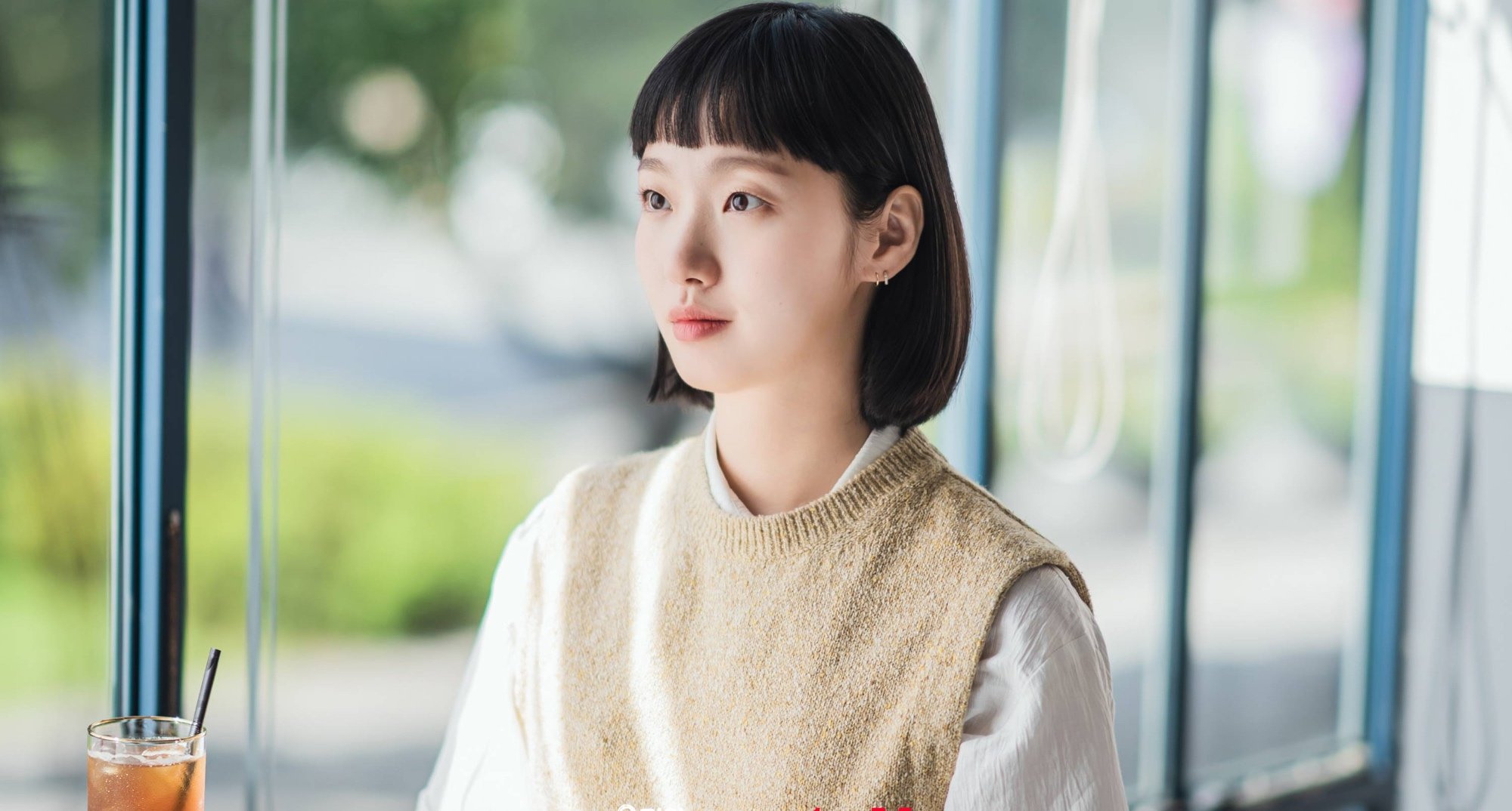 Kim Yu-mi in 'Yumi's Cell's in relation to who she marries wearing a vest sweater.