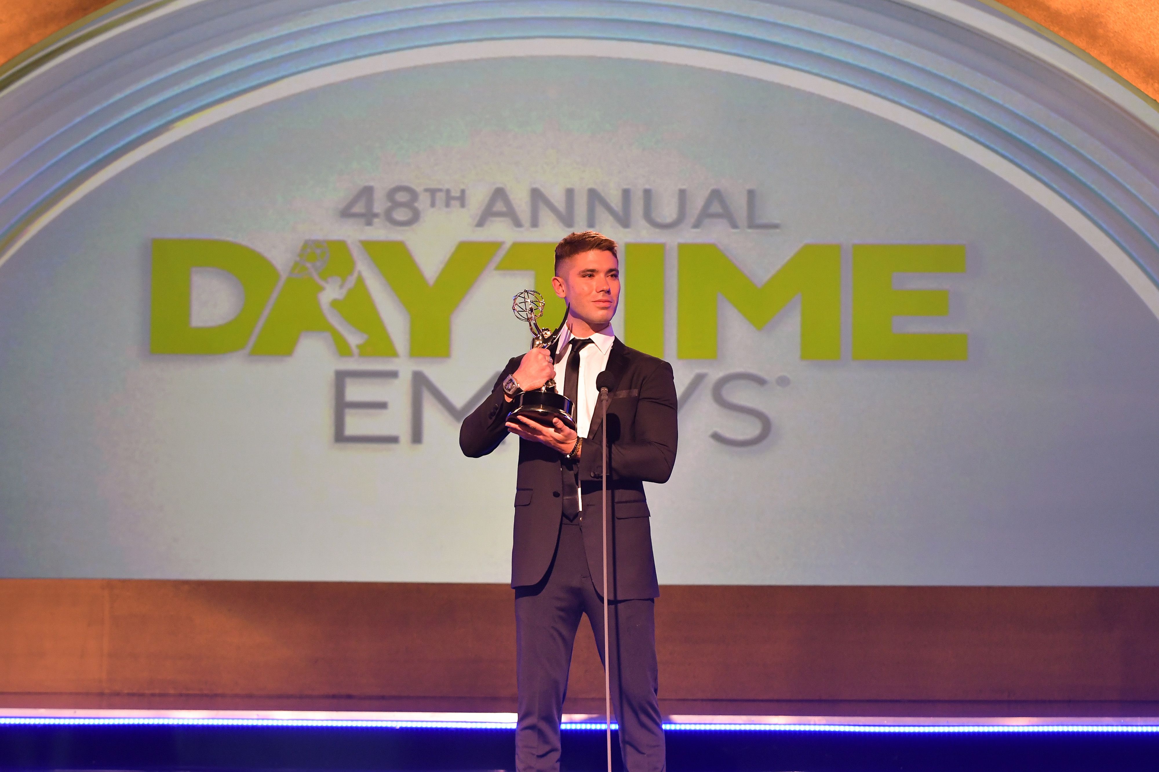 Kristos Andrews accepts the award for Outstanding Performance by a Lead Actor in a Daytime Fiction Program for "The Bay" during the 48th Annual Daytime Emmy Awards