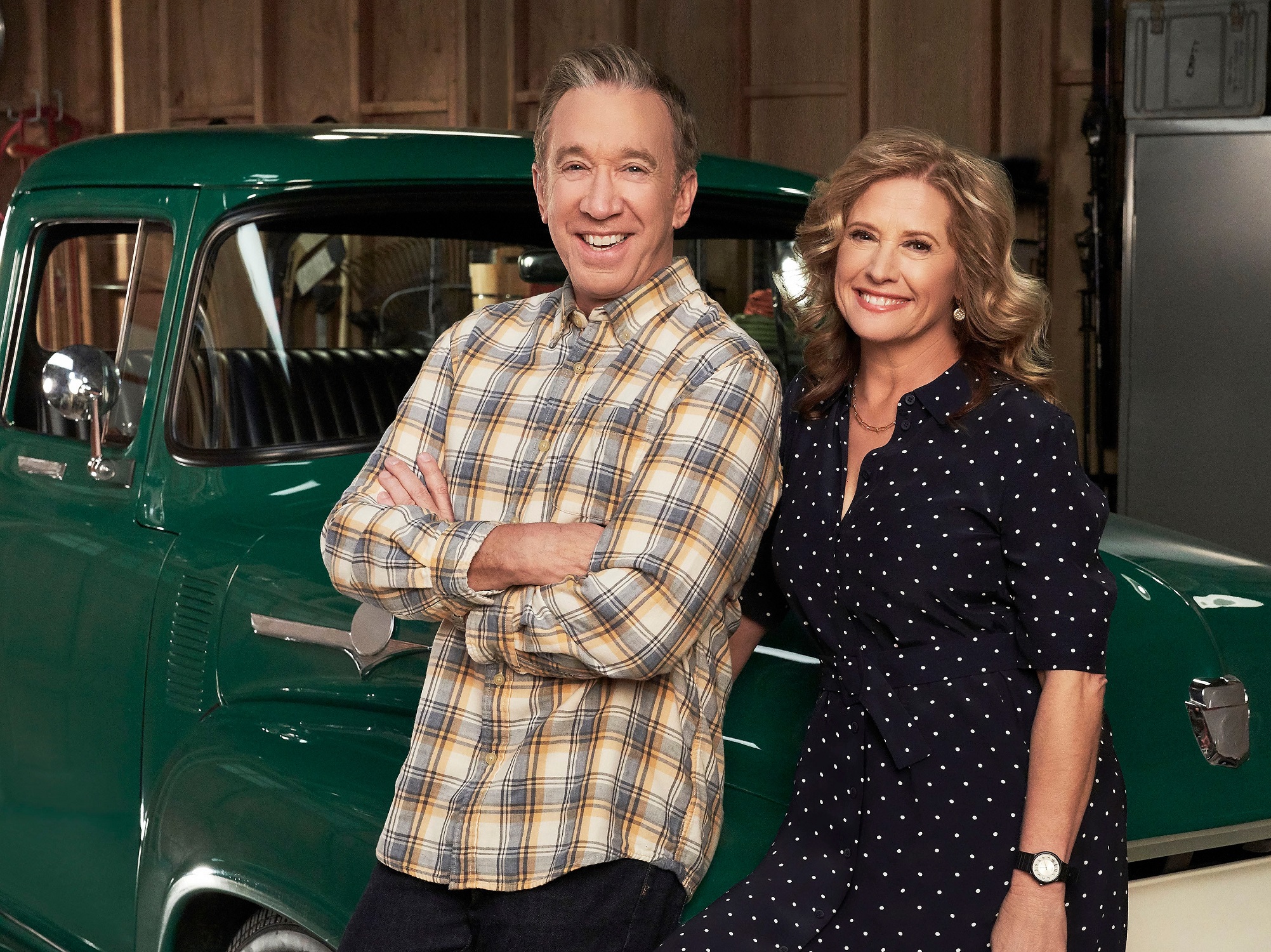 Tim Allen and Nancy Travis stand next to Mike Baxter's F-100 during the filming of 'Last Man Standing' 