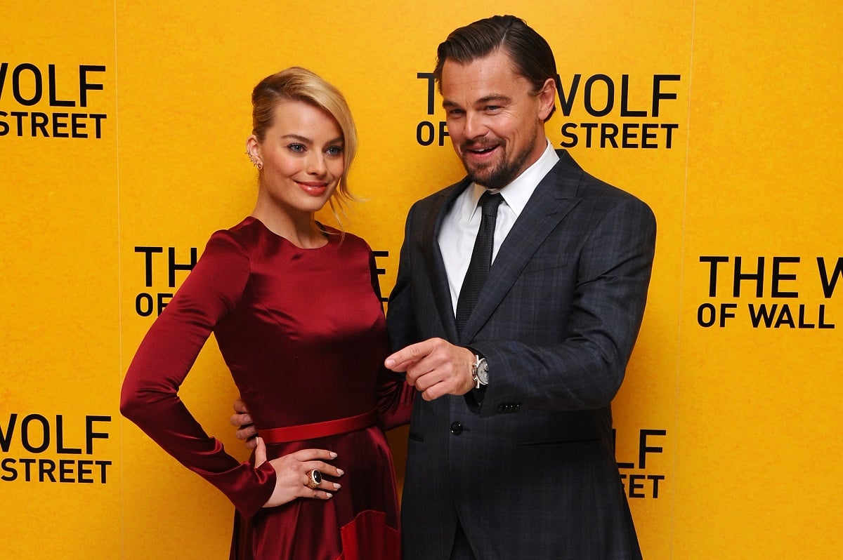 Leonardo DiCaprio smiling alongside Margot Robbie.