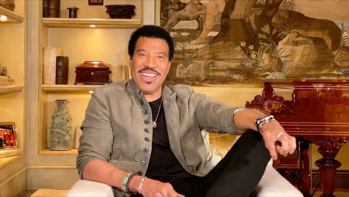 Lionel Richie sitting on a couch