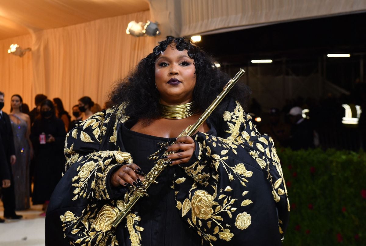 Lizzo holding a flute