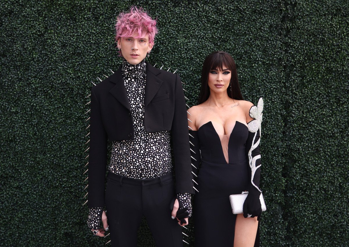 Machine Gun Kelly and Megan Fox pose together at an event.