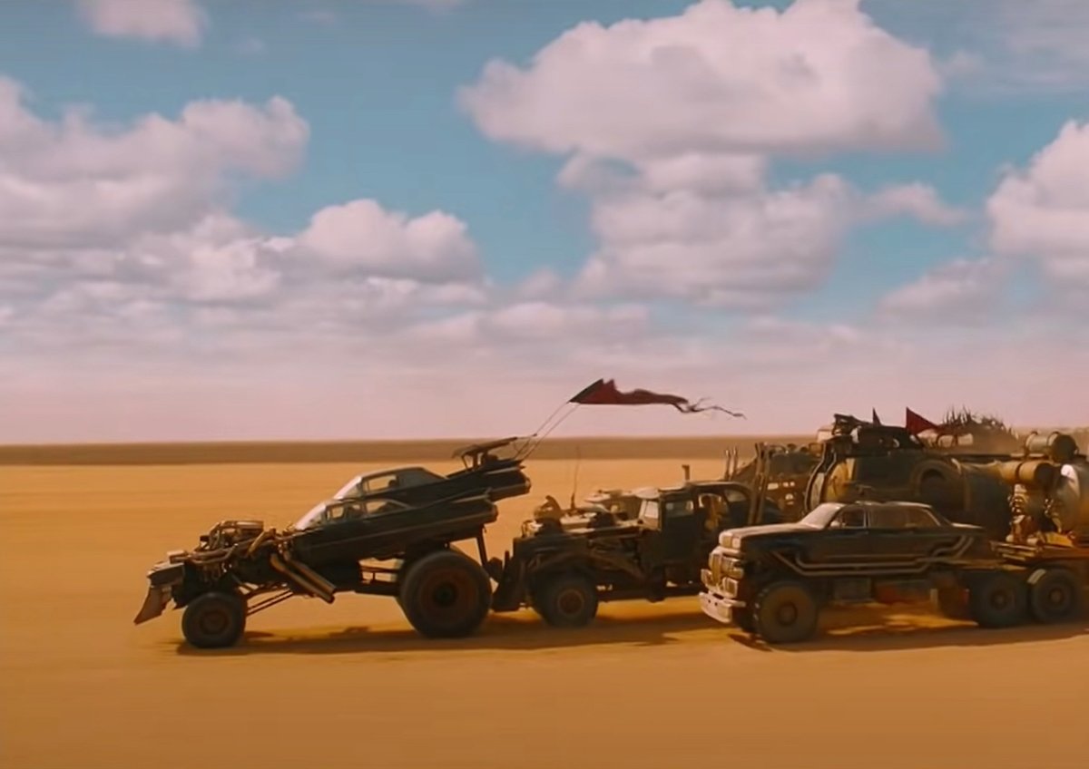 Vehicles race in the desert in Mad Max: Fury Road