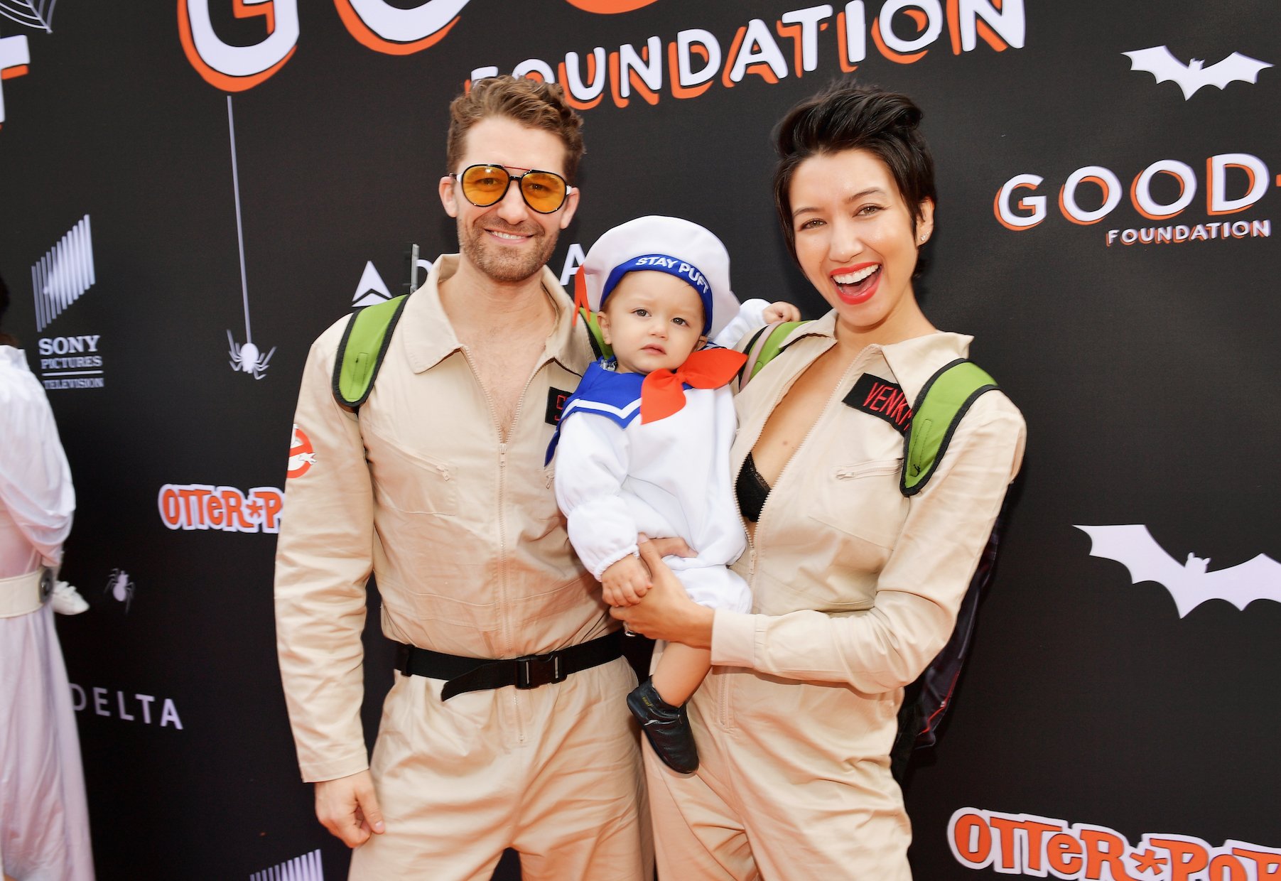 Matthew Morrison and wife Renee Puente with one of their kids at an event